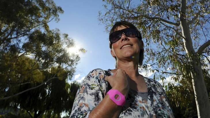 Dr Robyn Lucas, Associate Professor at the ANU College of Medicine, Biology and Environment wearing a watch which measures exposure to light. Photo: Graham Tidy
