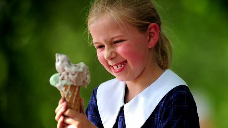 RACE AGAINST TIME:  Rose Thiele, 9, of Lyons, gets to grips with a rapidly melting double-flavoured ice-cream after school on  Monday. Photo: Melissa Adams