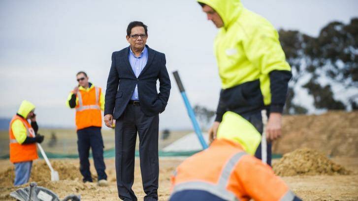 Vice president of the Canberra Muslim Community Tanveer Khan watches on as workers begin work on the footings of the Gungahlin Mosque in July. Photo: Rohan Thomson