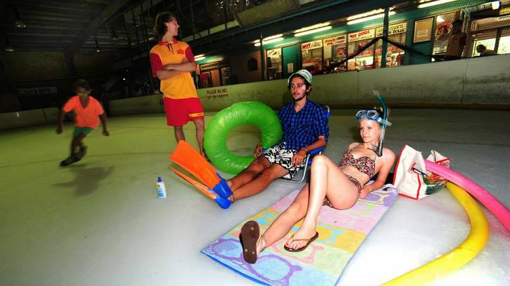 Cooling off at the Phillip skate rink during Canberra's hottest days are Woden swimming pool Lifeguard Rupert Denham, Alex Santiago, 19 of Jerrabomberra and Becky Bollen, 20 of Torrens. (skater is Axel Raut, 10 of Garran) Photo: Karleen Minney
