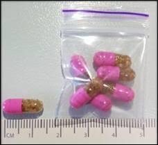 The drug is being sold in Canberra in pink and clear capsules, containing brown granular material. Photo: Supplied