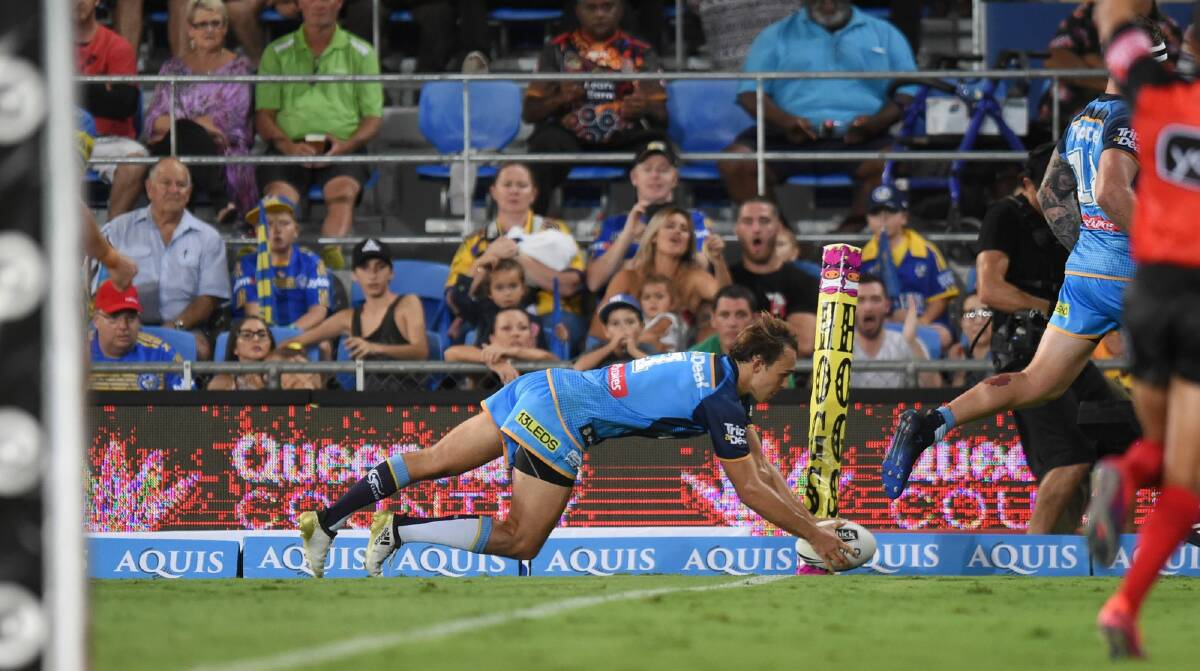 Tyler Cornish scores a try on debut for the Gold Coast Titans. Photo: NRL Photos