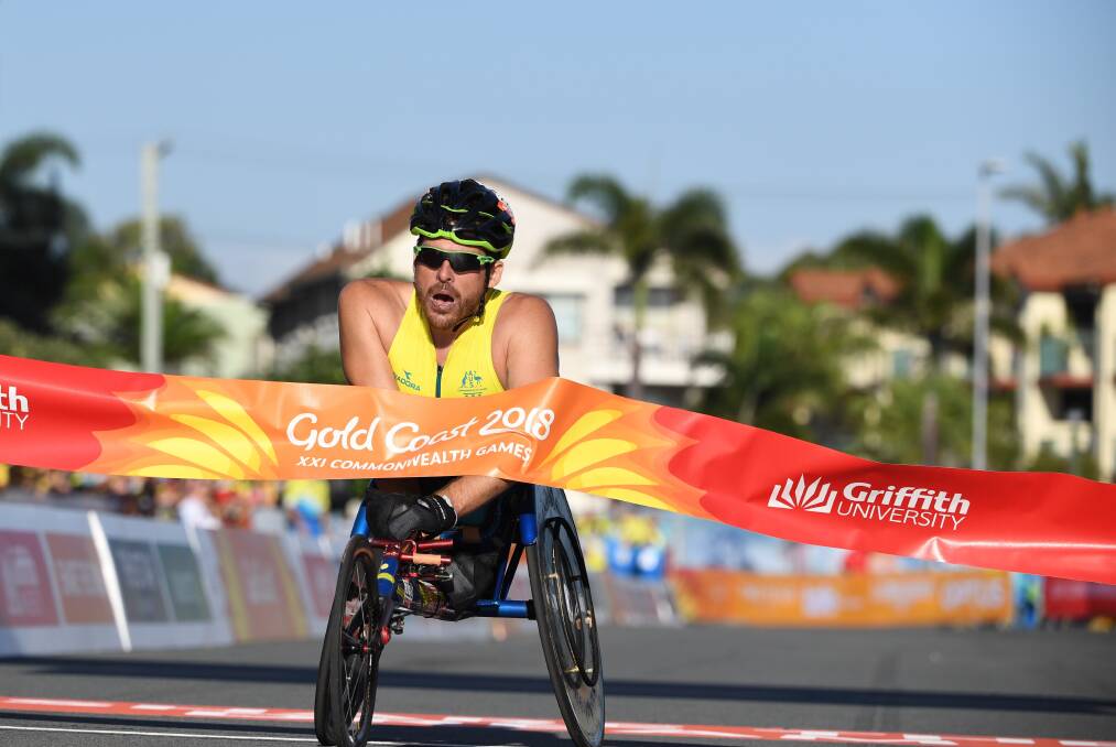 Kurt Fearnley of Australia wins the Mens T54 Marathon during the XXI Commonwealth Games. Photo: AAP