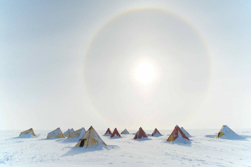 Tony Fleming's Aurora Basin camp with sun halo in Antarctica at PhotoAccess.