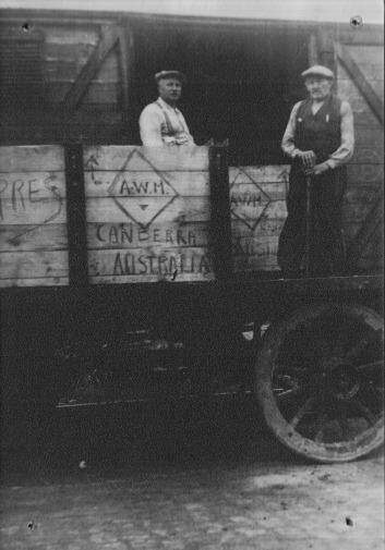Coming to Canberra: The boxes containing the lions are loaded on a train by Ypres workmen Remi Loison and Theo Tanghe in August 1936. Photo: Georges Vanraes