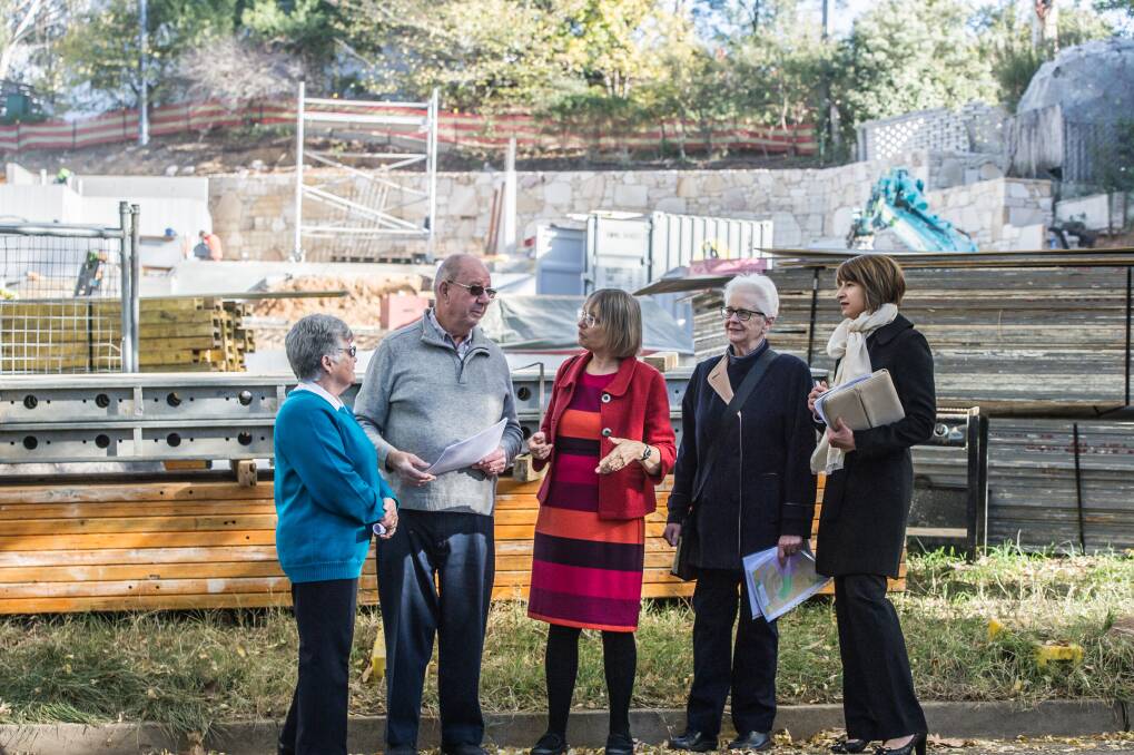 Residents of Jacka Crescent, Campbell, take Caroline Le Couteur, centre,  to see recent developments in the street. Residents from left are Caroll Perron, Mike Nash, Julie Doyle and Luisa Capezio. Photo: Karleen Minney