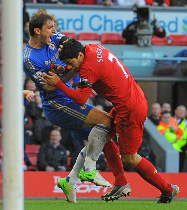 Luis Suarez was banned for biting Branislav Ivanovic. Photo: AP