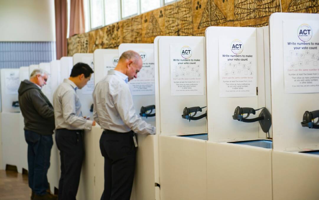 Canberrans cast their vote in the ACT election at Pilgrim House in Northbourne Avenue on Thursday.  Photo: Elesa Kurtz