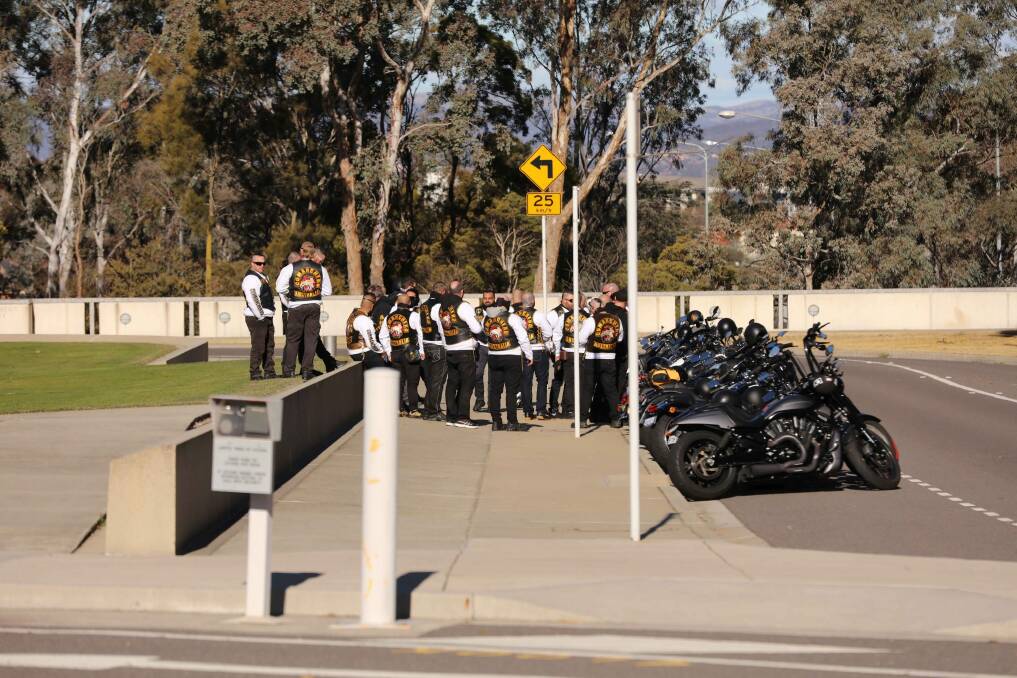 Members of the Comancheros gather outside Parliament House. Photo: ACT Policing