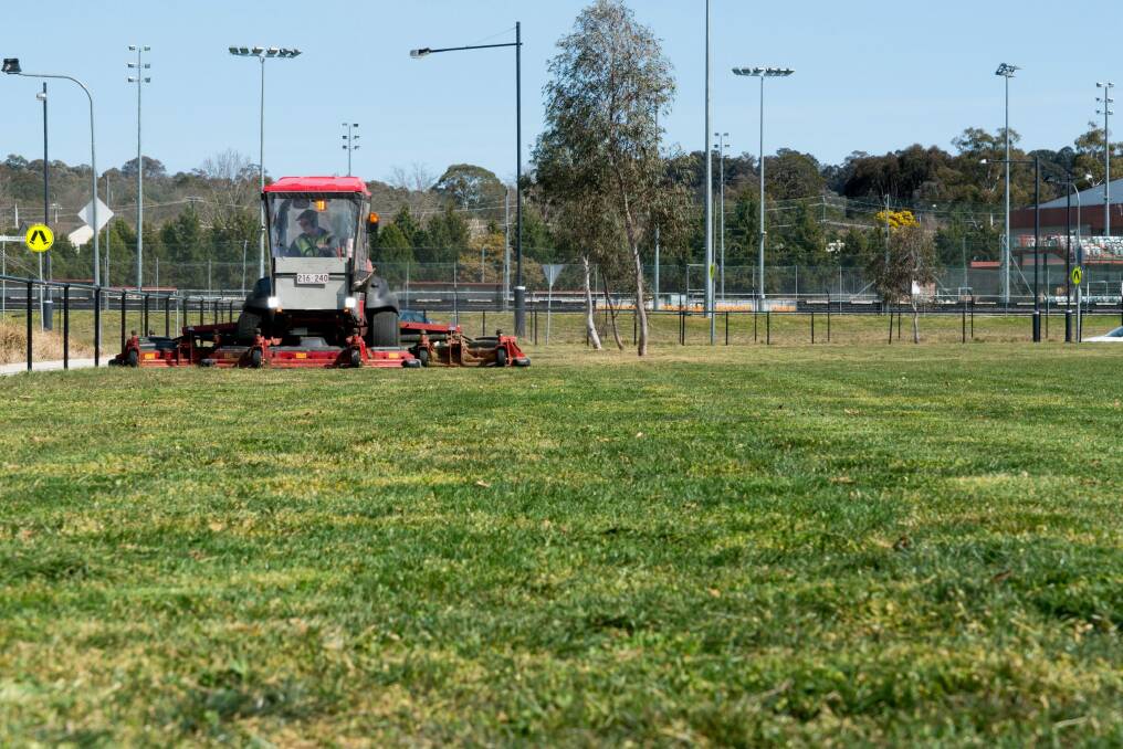 With the sun starting to heat the capital, the mowers are warming up to start some spring cleaning.  Photo: Supplied/ACT Government 
