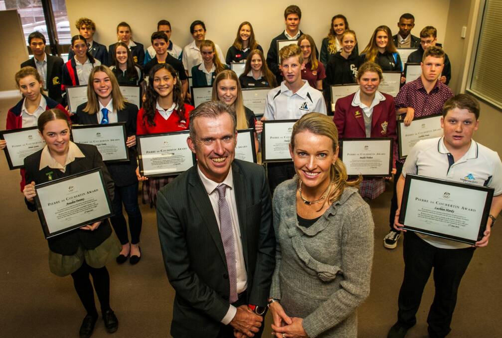 Olympians Shaun Creighton and Louise Dobson present Canberra Secondary School students with their 2016 Pierre de Coubertin Awards. Photo: Elesa Kurtz