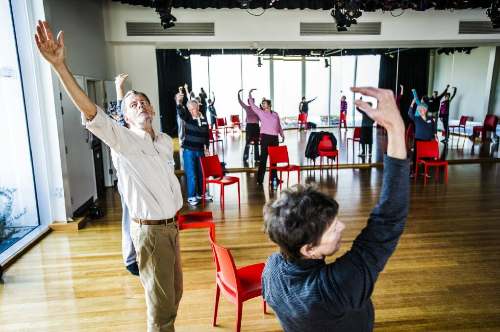 Chris Creswell, left, joins in the Parkinson's Dance Group, at the Belconnen Art's Centre. Photo: Jamila Toderas