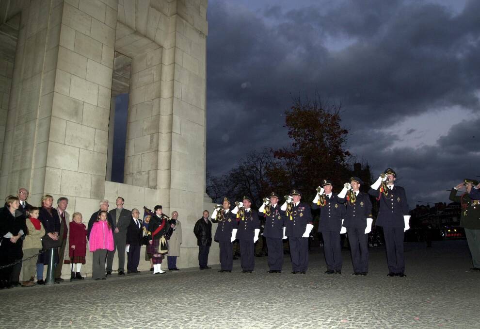 Bugle players from the Last Post Association sound off the 25,000th  Last Post  at the Menin Gate in Ieper, Belgium, Wednesday, Oct. 31, 2001.   The gate contains the names of some 50,000 Commonwealth soldiers who fell in World War I and whose remains have never been found.  Photo: Virginia Mayo