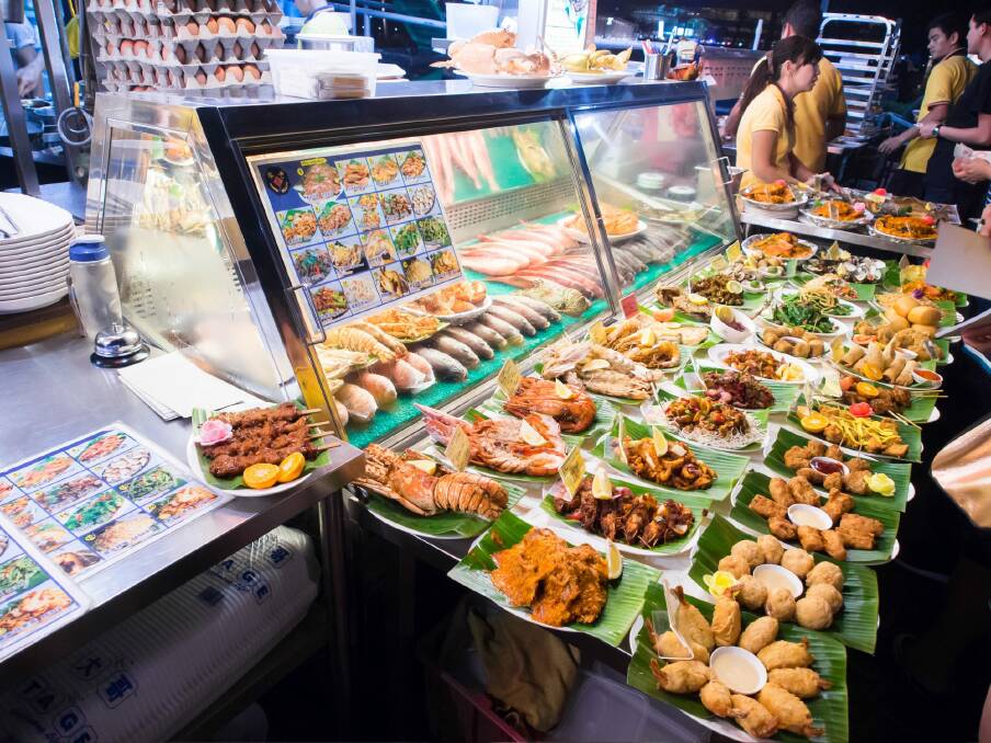 Hawker food can be found across Singapore and offers delicious cuisine.  Photo: Tanawat Pontchour