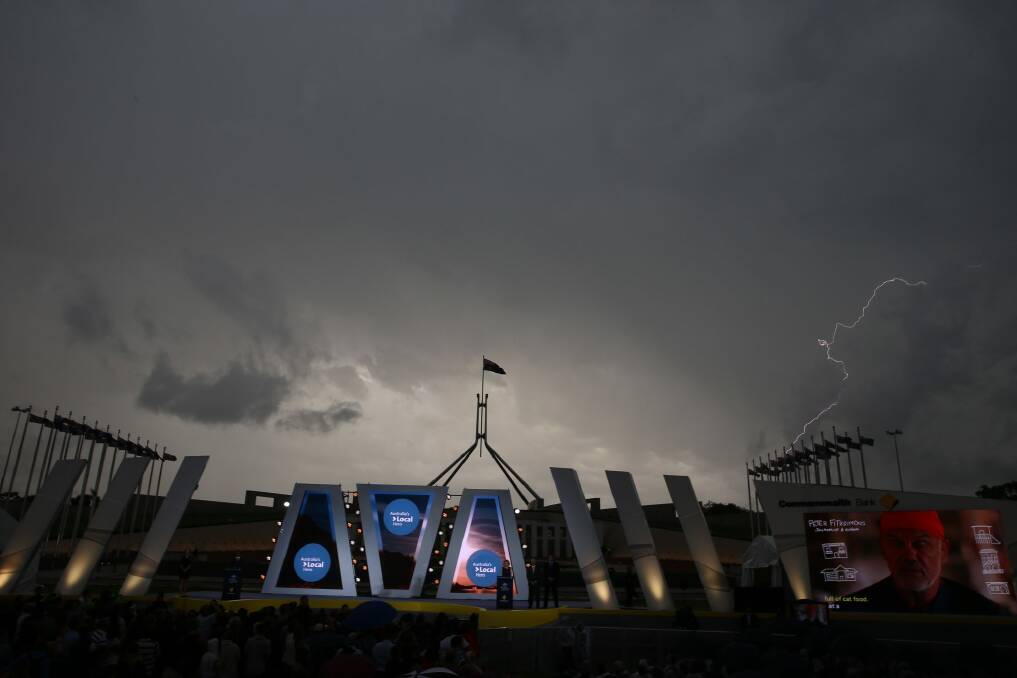 A storm passes over Australian of the Year ceremony. Photo: Andrew Meares