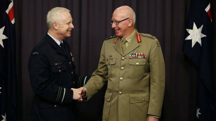 Incoming Chief of the Defence Force, Air Marshal Mark Binskin, is congratulated by outgoing chief General David Hurley. Photo: Alex Ellinghausen