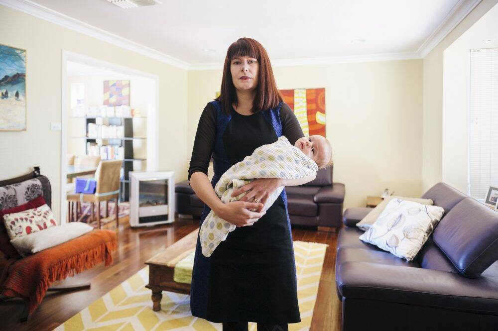 Brianna Heseltine and baby Marcus in their Weston home. She is the spokeswoman for the Fluffy owners and residents group, Photo: Rohan Thomson