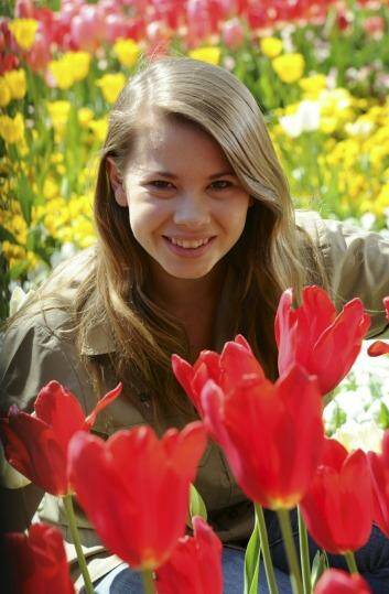 Bindi Irwin poses in a garden bed at Floriade.  Photo: Graham Tidy