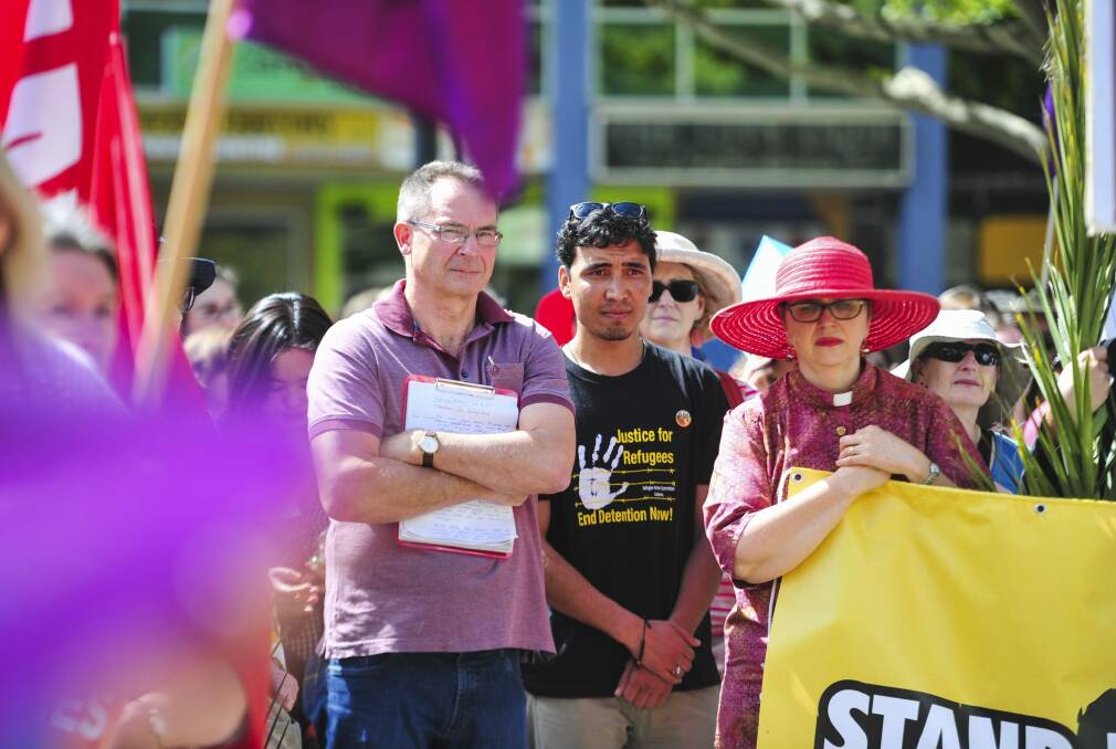 From left, former chief minister Jon Stanhope and former refugee Ismail Hussaini in Garema Place for the rally. Photo: Melissa Adams