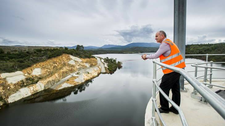 Actew's Chris Webb looks out from the Cotter Dam wall. The water is currently at 47%. Photo: Rohan Thompson
