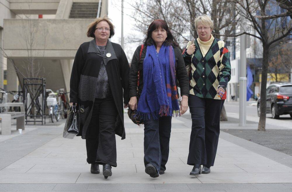 Carolyn Drew,
spokeswoman for Animal Liberation ACT, centre, with supporters Debbie
Soxsmith, left and her sister Robyn Soxsmith, outside the ACAT
hearing. Photo: Graham Tidy