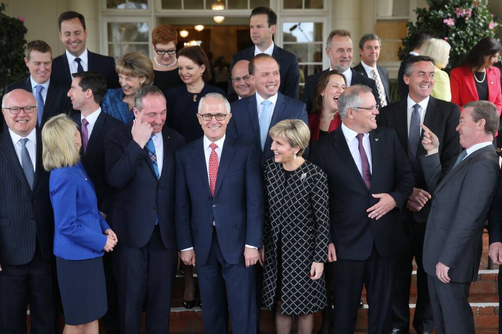 Malcolm Turnbull with his cabinet ministers after they were sworn in at Government House. Photo: Andrew Meares