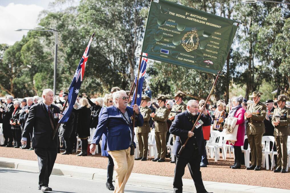 Hundreds applauded as veterans of the battle marched down Anzac Parade in front of the Australian Vietnam Forces National Memorial. Photo: Jamila Toderas