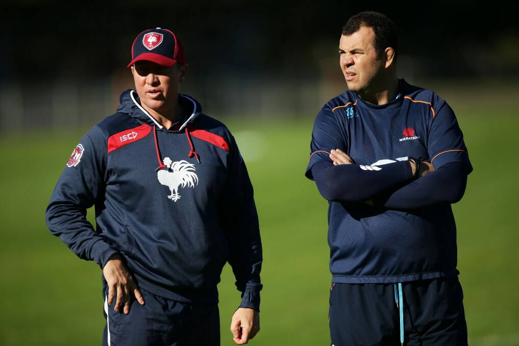 Comparing notes: Trent Robinson and Michael Cheika at a joint training session between the Roosters and Waratahs this year. Photo: Getty Images