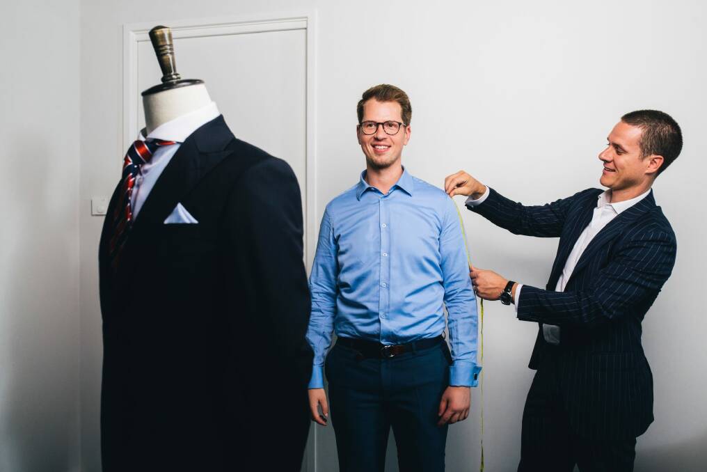 Institchu co-founder James Wakefield measures up John Mason in the new Canberra store. Photo: Rohan Thomson