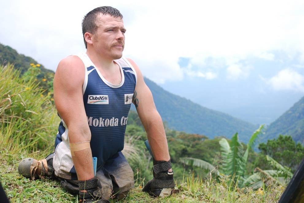 Paralympian Kurt Fearnley on the Kokoda Trail in 2009. He crawled the epic journey in memory of his cousin, Peter Smith, who died by suicide in 2009. Now Kurt is coming to Canberra to again honour the memory of Peter by attending a fundraising dinner for the 6NIL anti-suicide campaign and for Liifeline. Photo: Supplied