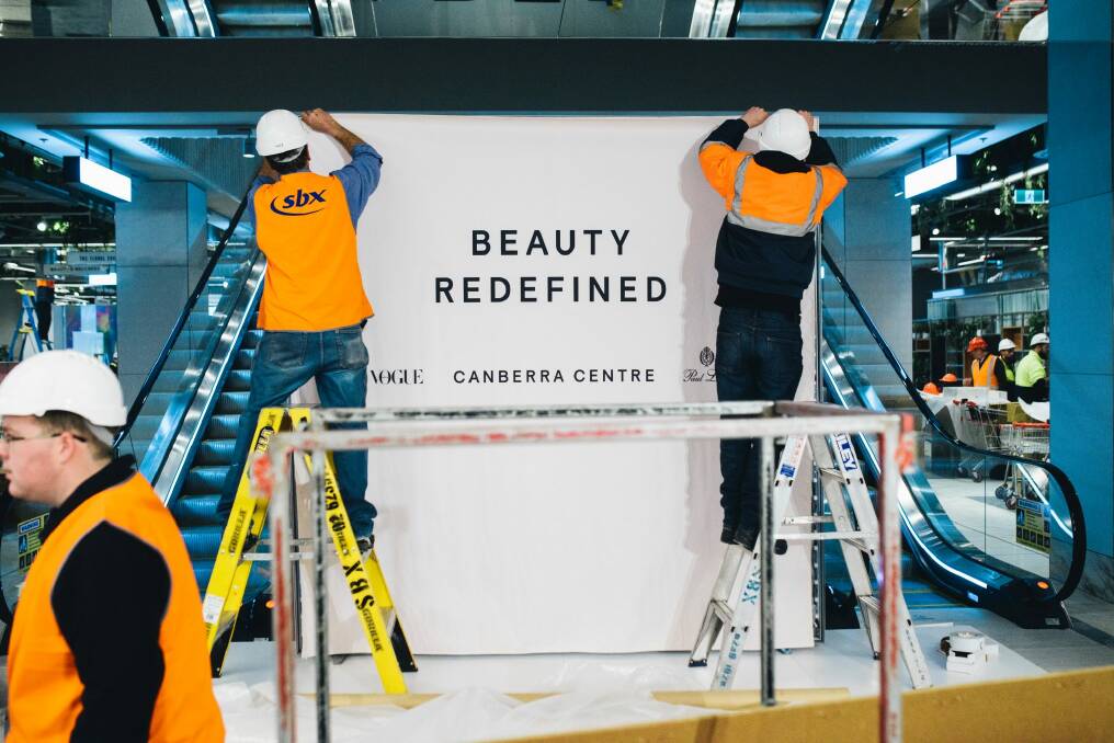 Workers preparing for the opening of the Canberra Centre's Monaro Mall beauty shopping area on Thursday. Photo: Rohan Thomson