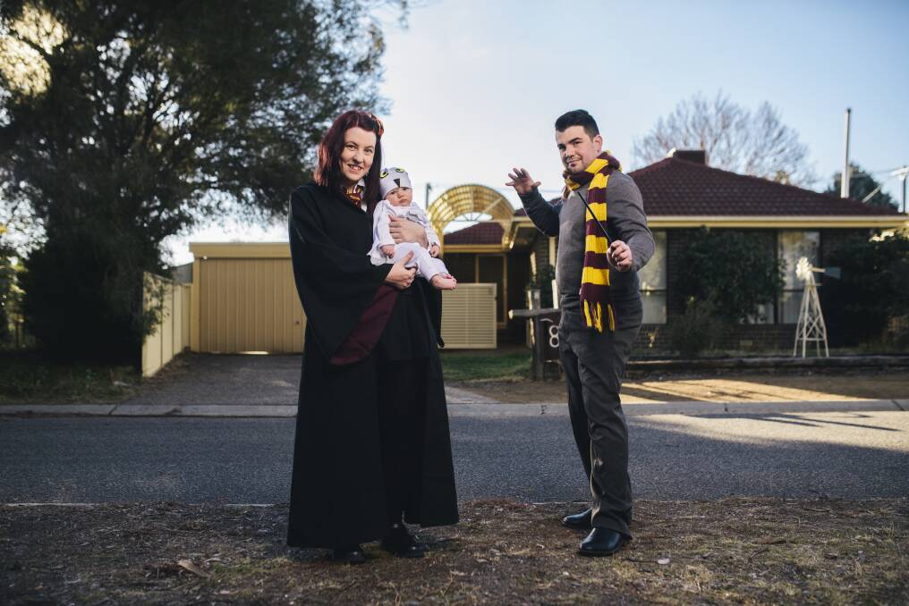 Andrew and Bec Grayson and baby girl Aurora at home in their Harry Potter cosplay outfits. Photo: Rohan Thomson