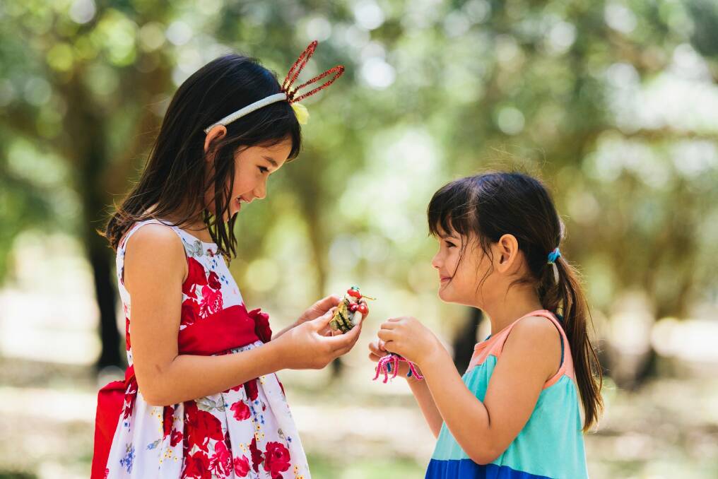 Madison, 6, and Alysha Oei, 5, of Duntroon made "cork craft" out of cork and acorns. Photo: Rohan Thomson