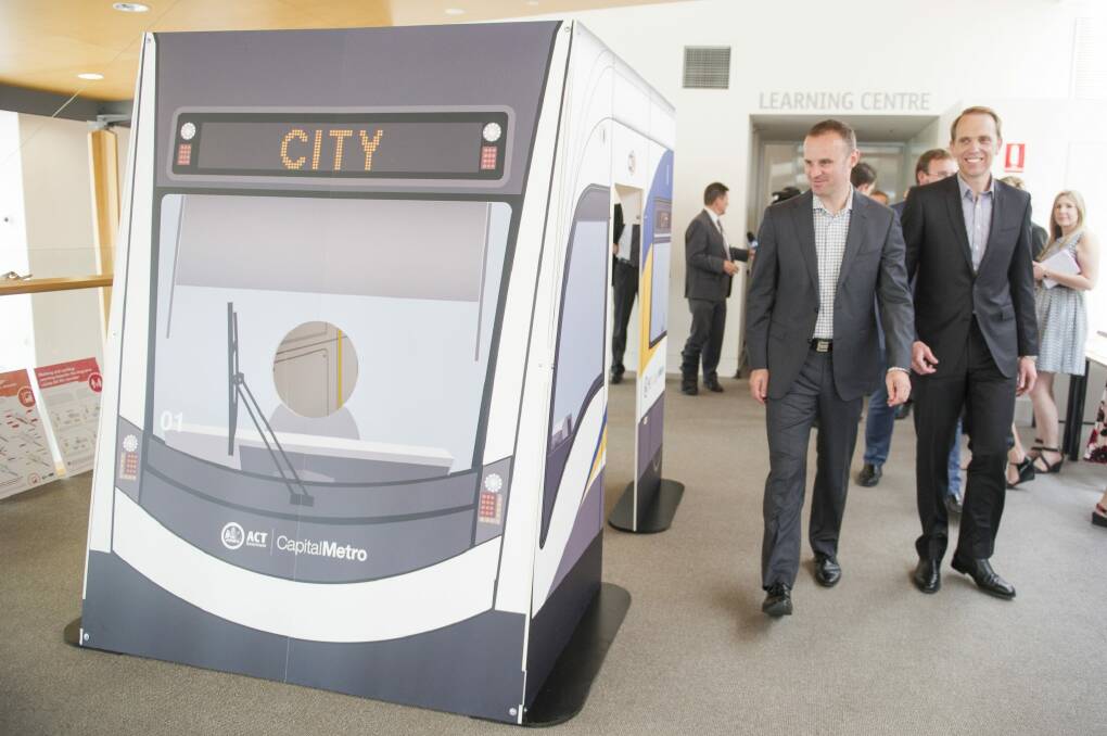 ACT Chief Minister Andrew Barr and Minister for Capital Metro Simon Corbell inspect a model of the tram. Photo: Jay Cronan