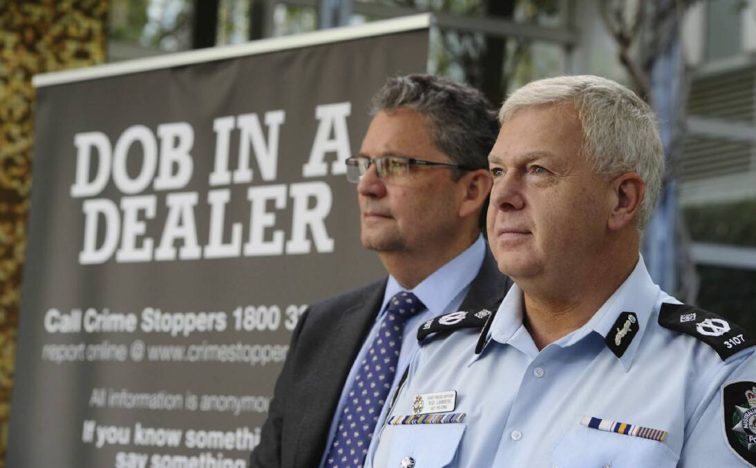 Crime Stoppers ACT chairman Bryan Roach, along with Rudi Lammers, ACT Chief Police Officer, want Canberrans to dob in their drug dealers. Photo: Graham Tidy