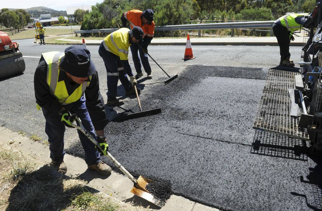 Roads ACT is trialling a carbon-reduced asphalt mix, using recycled toner cartridge powder. Photo: Graham Tidy