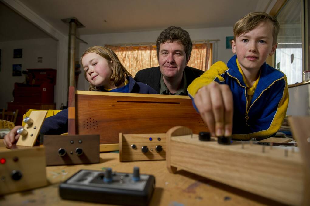 Brian McNamara with his electronic instruments and children Rhianna and Edgar. Photo: Jay Cronan
