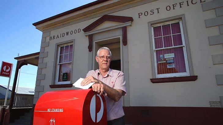 Small town hub: Bruce Keeley at Braidwood Post Office, which he has run for 16 years. Photo: Andrew Meares