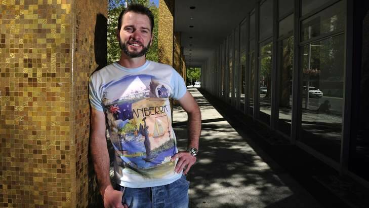 Aaron Chandler shows off his vintage Canberra T-shirt. Photo: Jay Cronan