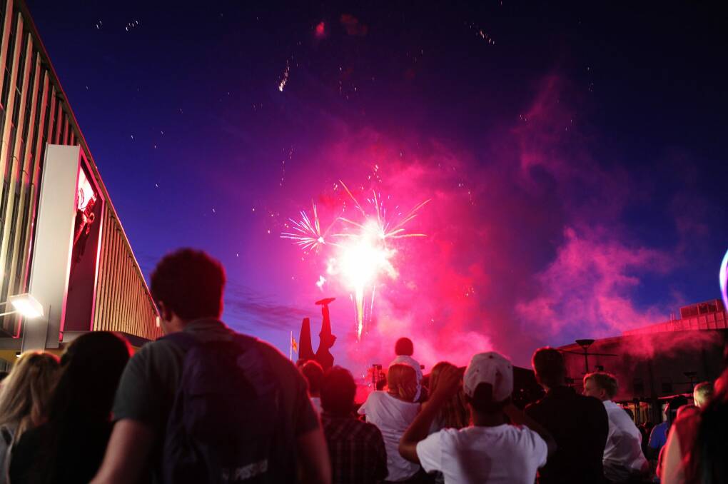 Fireworks go off during the celebration of New Year's Eve at Civic Square in Canberra. Photo: Melissa Adams 