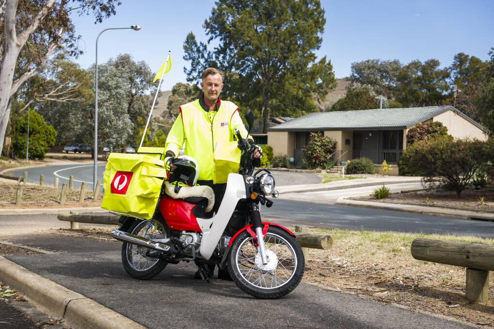 AusPost delivery officer, Shane Wilson and AusPost are calling for people to drive safe around posties and control their dogs after 24 incidents last financial year. Photo: Elesa Kurtz