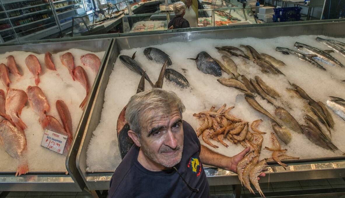 Fyshwick seafood shop (Fishco) owner John Fragopoulos expects prawn prices could soon soar to $100 per kilo after the Australian Government's import ban on raw prawn meat cuts supply.  Photo: Karleen Minney