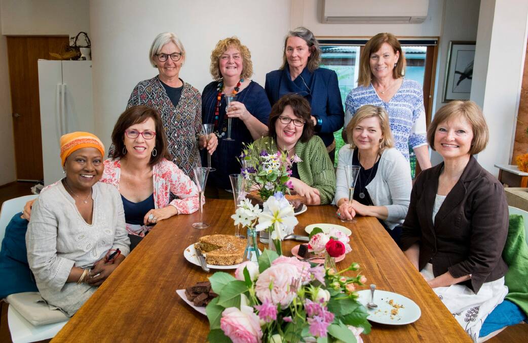 The Singed Sisters were a group of women who supported each other in the aftermath of the January 2003 bushfires. Nearly 15 years after the disaster, the sisters have released a cookbook which tracks their journey from devastation to celebration. Pictured are (standing l-r): Liz Walter, Jane Fitzgerald, Peta Mackenzie Davey and  Julie Pham and 
(seated l-r) Chandani Prammer, Liz Tilley, Alison Mills, Karen Downinga dn Sue Kukolic Photo: Supplied