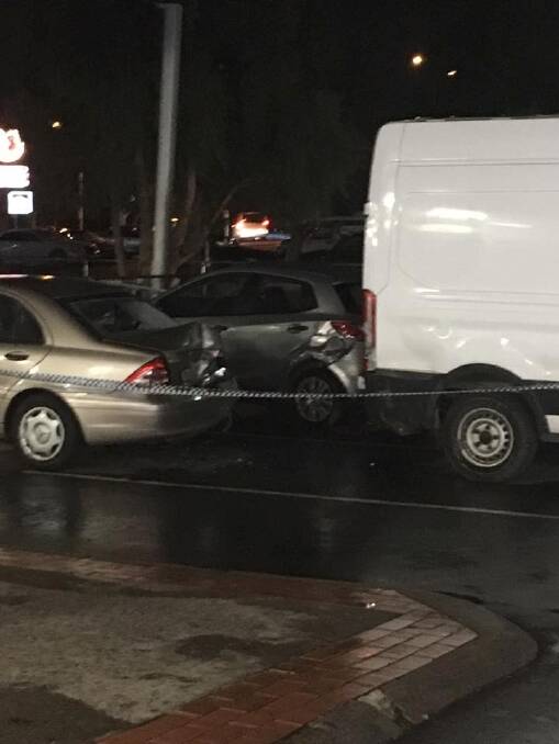 A stolen van was allegedly rammed into parked cars at Wanniassa shops. Photo: Facebook