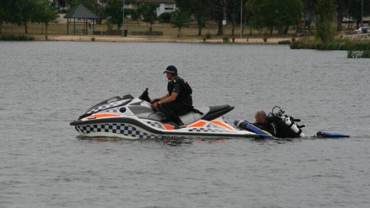 Police divers are searching Lake Tuggeranong. Photo: Grant Newton