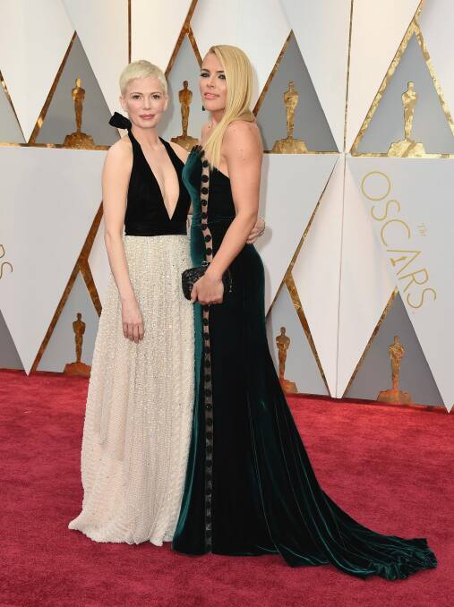 BFFs Michelle Williams, left, and Busy Philipps at the Oscars. Photo: Jordan Strauss