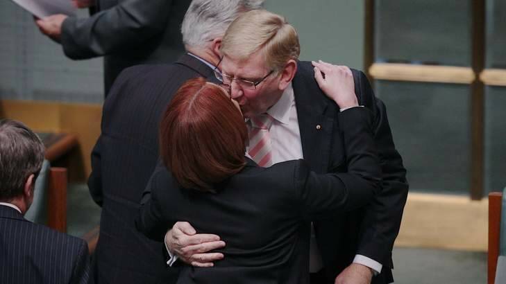 Prime Minister Julia Gillard and Labor MP Martin Ferguson embrace after he announced his resignation. Photo: Alex Ellinghausen / Fairfax