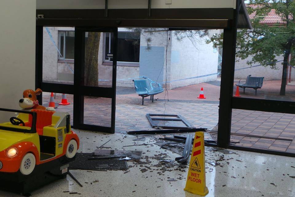 The doors of the Kippax Fair shopping centre after the ram raid. Photo: ACT Policing