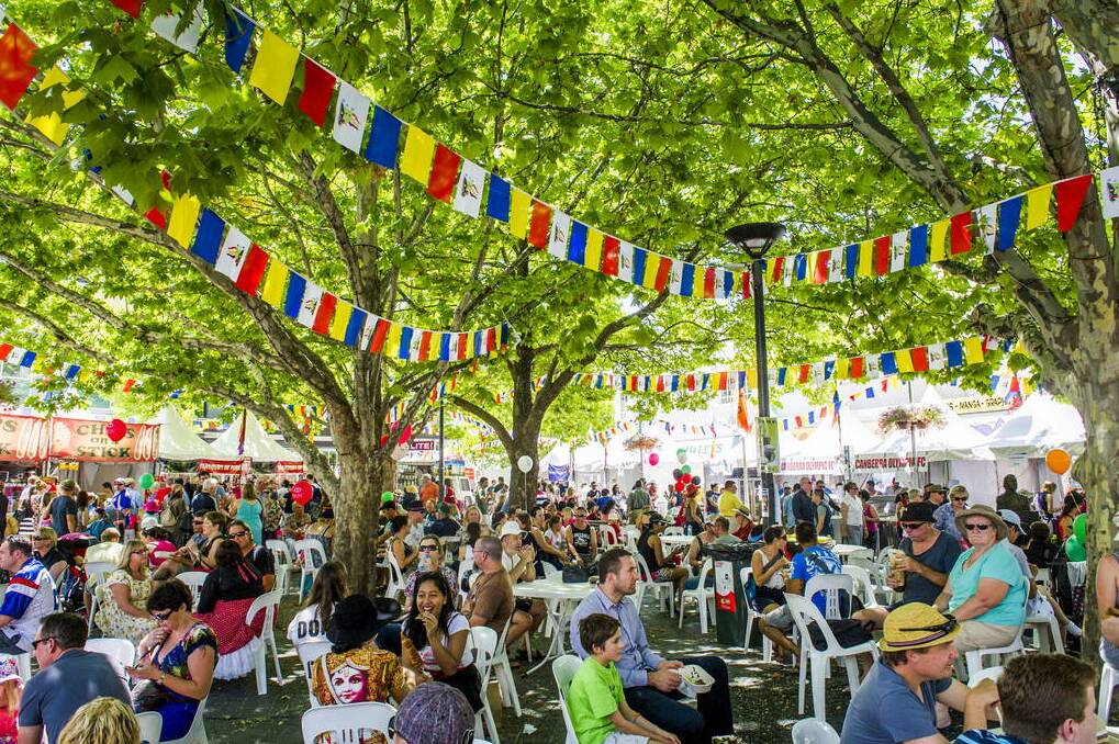 People rest in the shade at the Multicultural Festival. Photo: Rohan Thomson