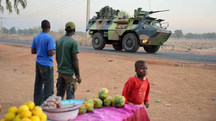 FORMER COLONY: A French armoured vehicle leaves Bamako on deployment to the north of Mali as part of the ''Serval'' operations on January 15.